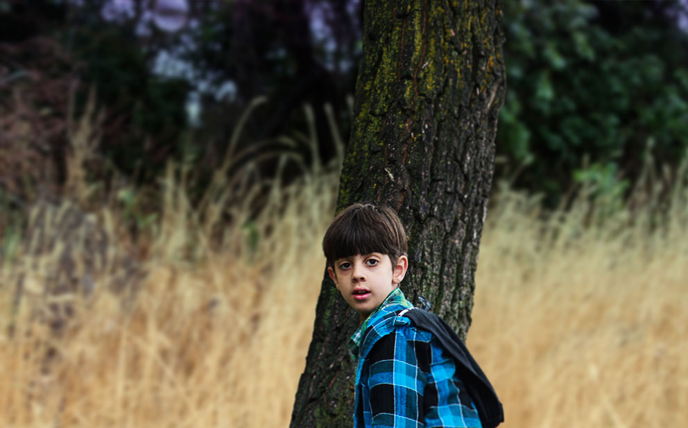 boy near tree