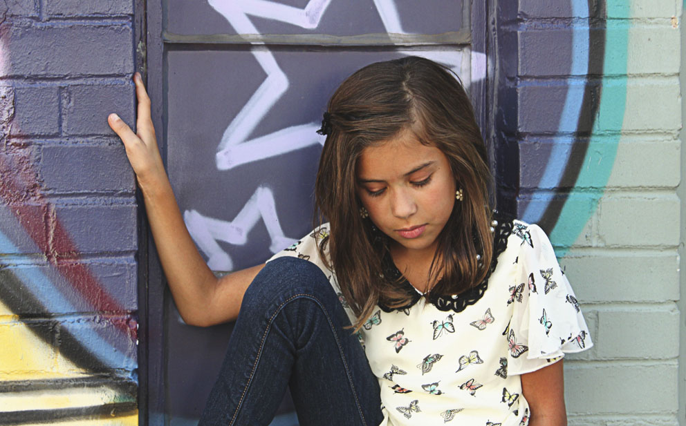 girl against graffiti wall