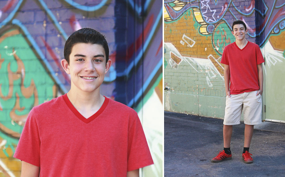 boy against graffiti wall