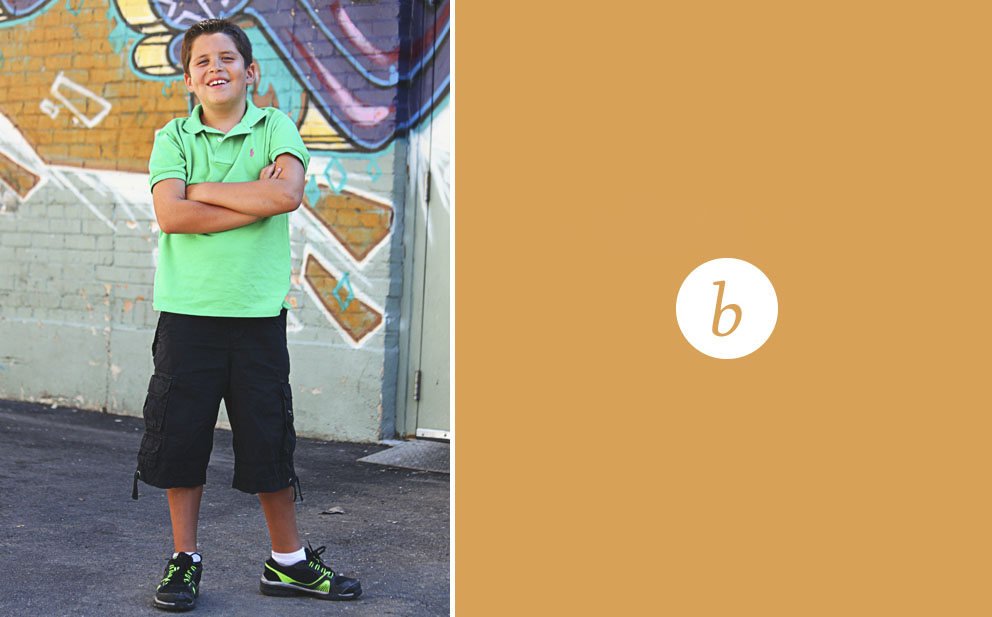 boy against graffiti wall