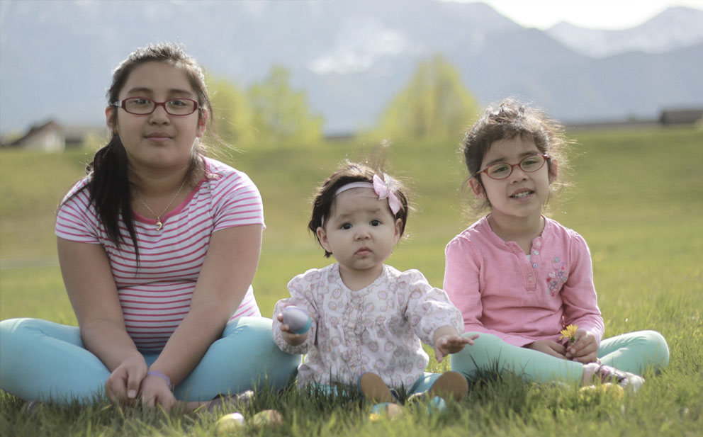 girls sitting on grass