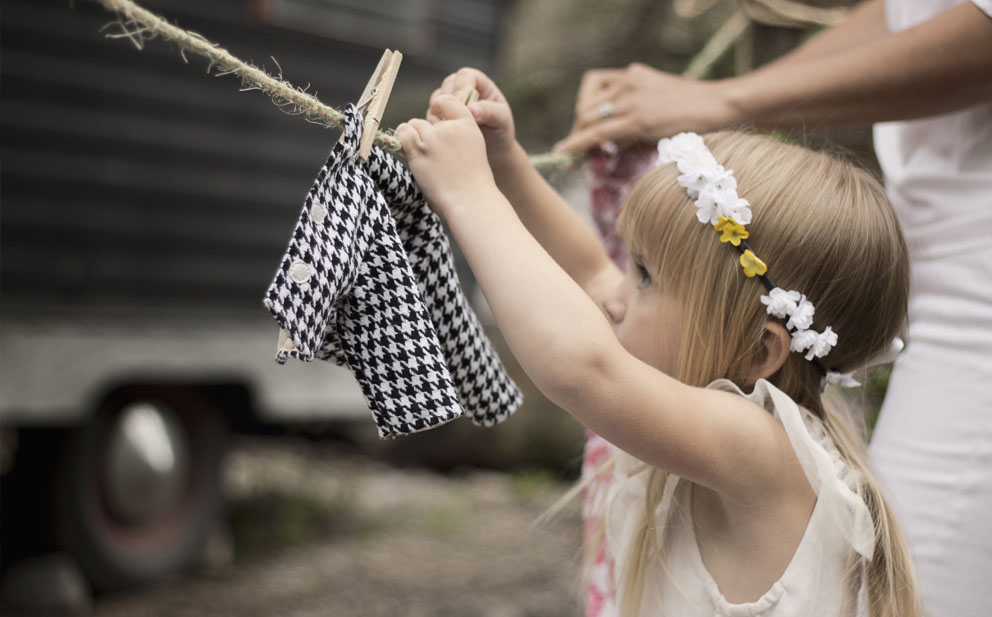 girl hanging laundry
